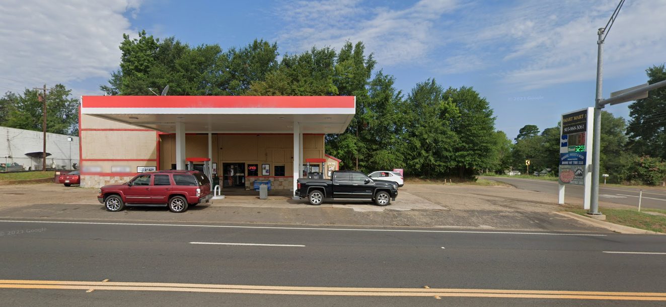 Smart Mart 3 storefront and fuel canopy at 100 S Main St