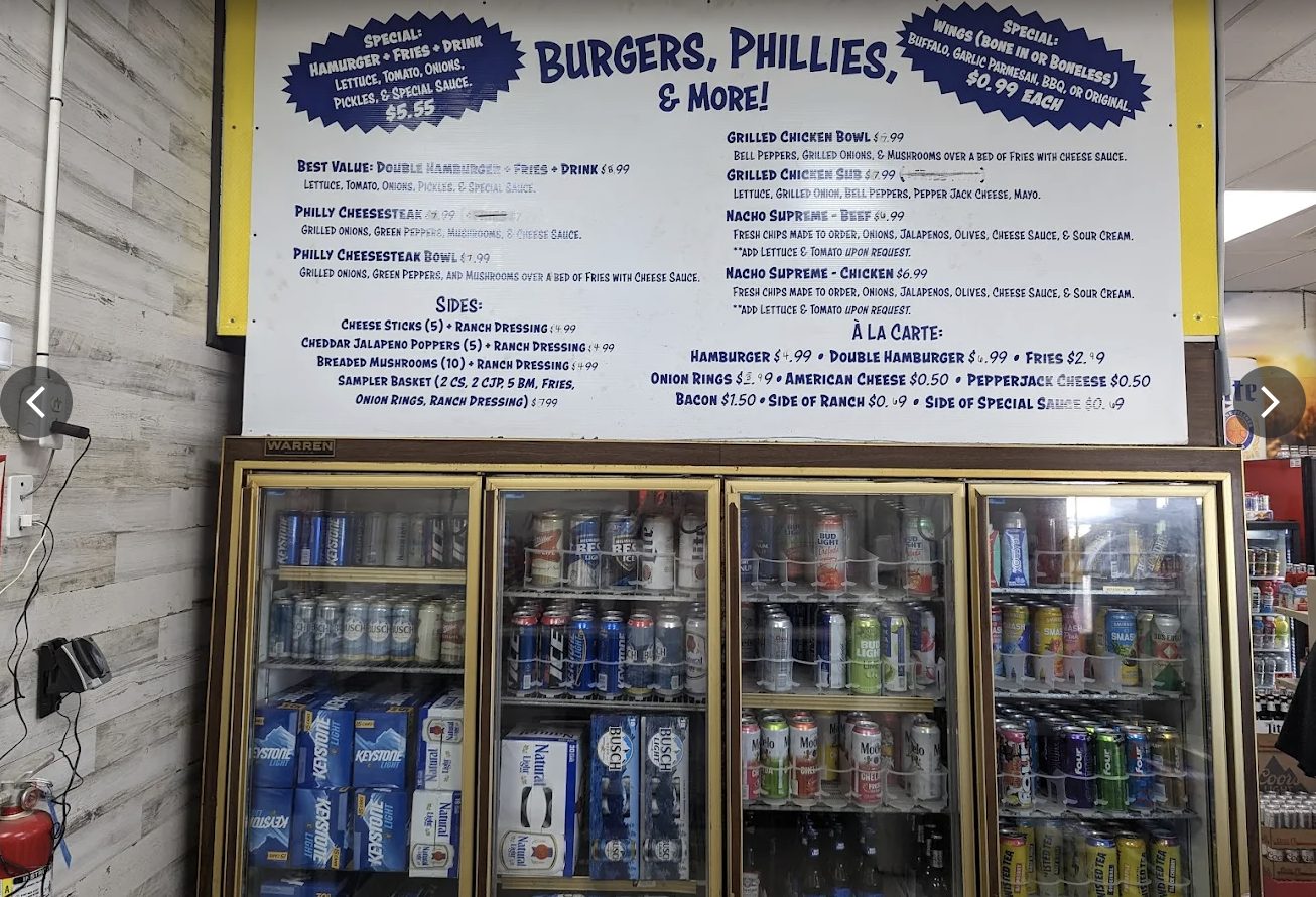 Deli menu board above the beer cave doors